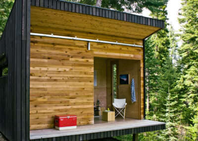 D - Retreat cabin with vertical and horizontal weatherboard front