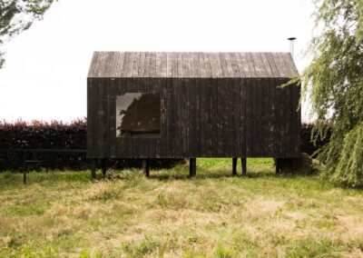 O - Rustic cabin on poles side